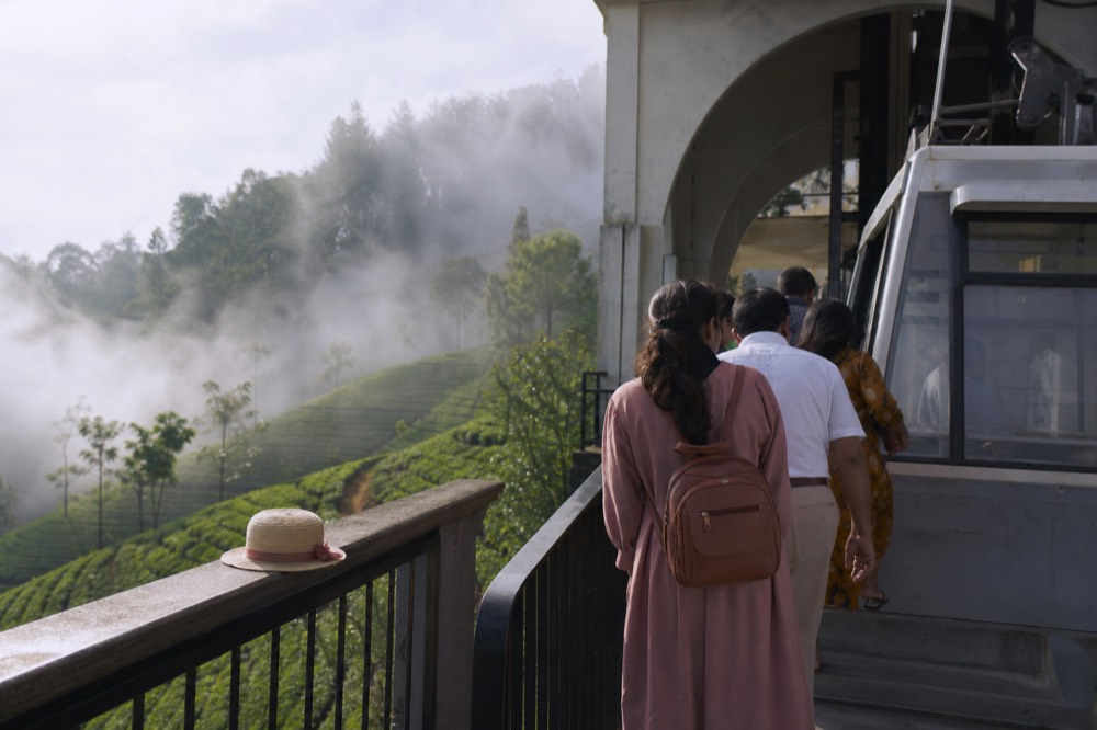 Passengers boarding a gondola cabin at a mountain station, no text, no logos, no people